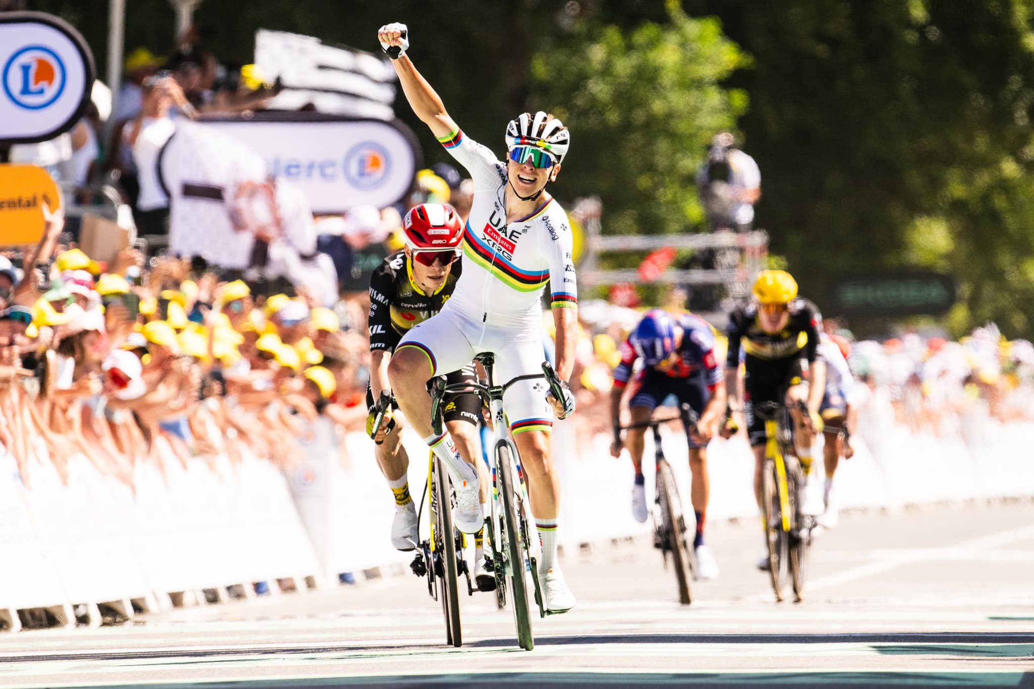 Tadej Pogacar wearing UCI World Champion rainbow jersey wins Tour de France Stage with Mummu Cycling